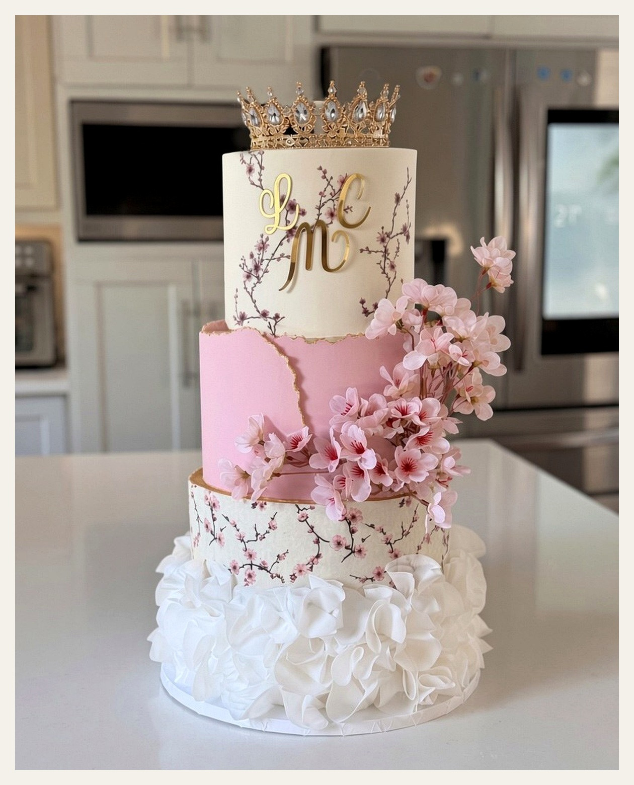 Pink floral crown celebration cake with gold leaf