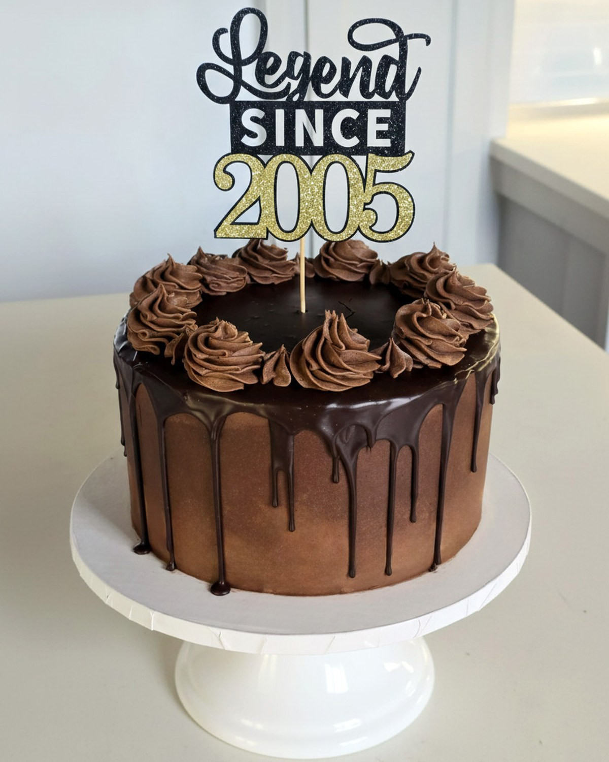 Chocolate drip birthday cake with chocolate buttercream rosettes